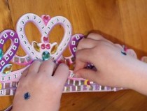 Placing the stickers onto the tiara. 