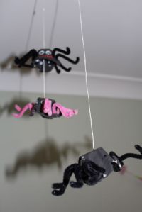 Spiders hanging from the ceiling.