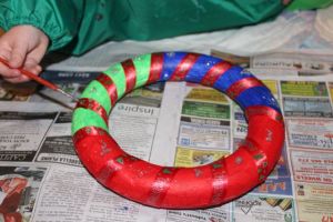 Adding glitter glue.