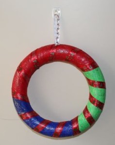 Hanging on the front door.