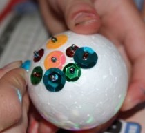 L working on her sequined bauble.