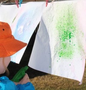 A spraying her paper.