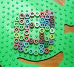 L made this design on our penguin pegboard.