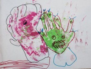 L's monster drawing using A's messy hand print painting.