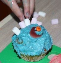 Adding mini marshmallows.