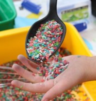 Sifting the rice through a slotted spoon.