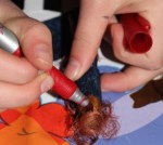 L drawing on a face. 