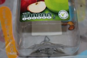 The slot at the base of the dispenser.