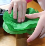 Adding more layers of tissue paper.