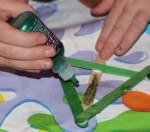 Adding glitter glue.