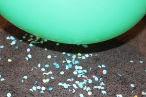 Lifting paper off the floor.