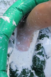 Squishing slime through her toes.